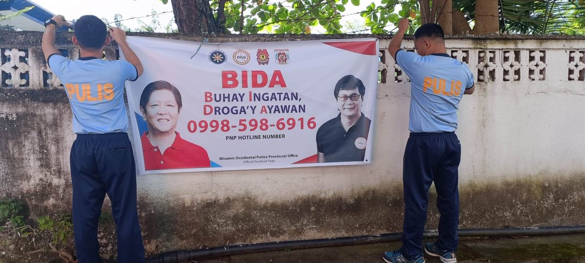 MisOccPPO's tweet photo. On March 21, 2023, at about 2:00 PM, PSSg Jun G Caliskis, Community Organizing PNCO, and PCpl Michael B Pausanos, IO PNCO, of the Police Community Affairs and Development Unit, hung a tarpaulin for the BIDA Program o Buhay Ingatan, Droga'y Ayawan. https://t.co/S3NKg5UVFJ