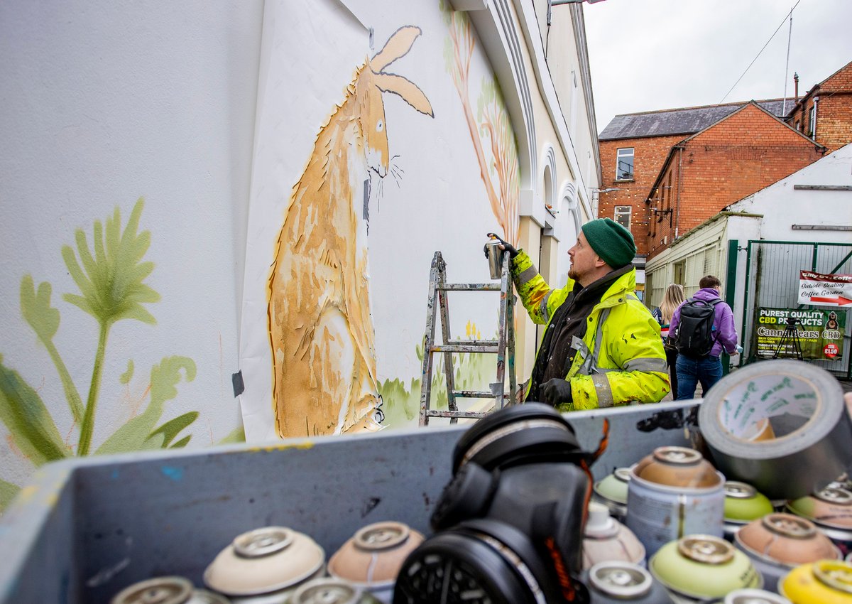 Guess what’s coming soon to Lisburn city centre? Street artist Dean Kane from @visualwaste is transforming Haslem’s Lane in Lisburn today. Keep an eye on our socials to hare all about it! #guesshowmuchiloveyou Walker Books Walker Picture Books