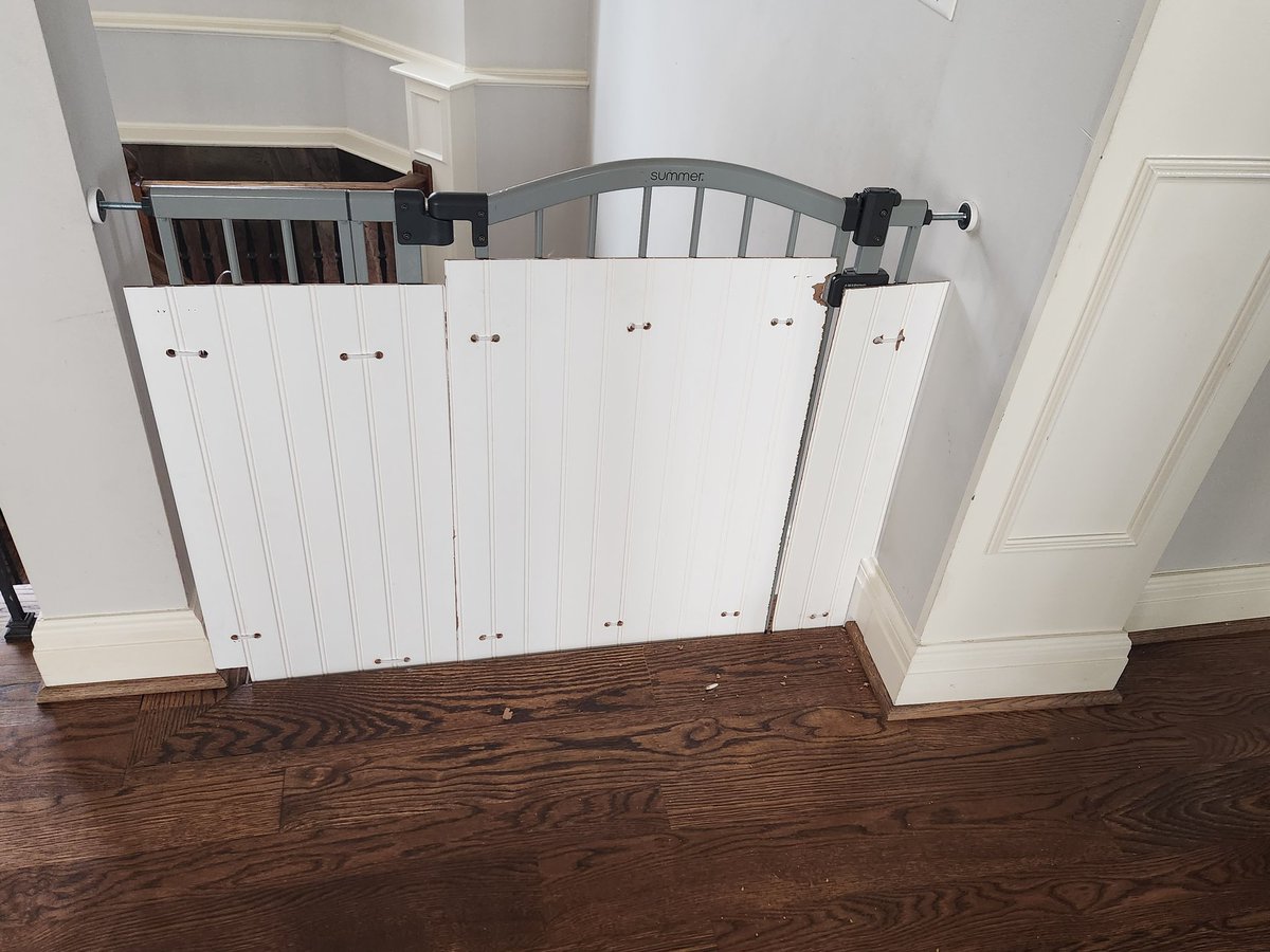 Fightincowboy's tweet photo. The cat kept squeezing through the baby gate and Paige didn't want him downstairs with the newborn coming so I had to do a little redneck engineering. Of course the damn paint splintered on the very last hole I had to drill. https://t.co/HgsG9dCf9P