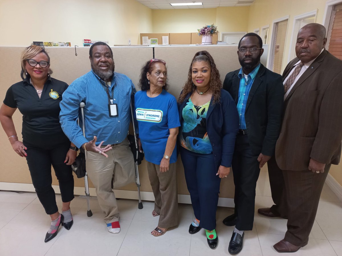 Some of the staff of the National Commission for Persons with Disabilities Secretariat in the Ministry of Social Services and Urban Development showing support for World Downs Syndrome Day and Rock Your Socks