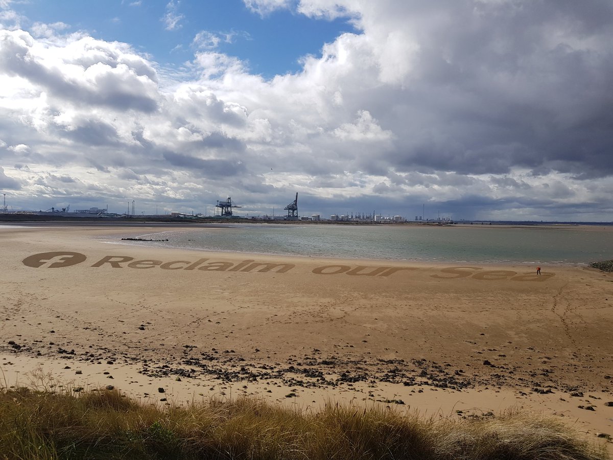 'Reclaim our sea' superbly marked into the sand at Bran Sands/South Gare this afternoon as part of the protest against mass die-offs on the north east coast recently, & a campaign to reduce pollution. #reclaimoursea #muchneeded #environment