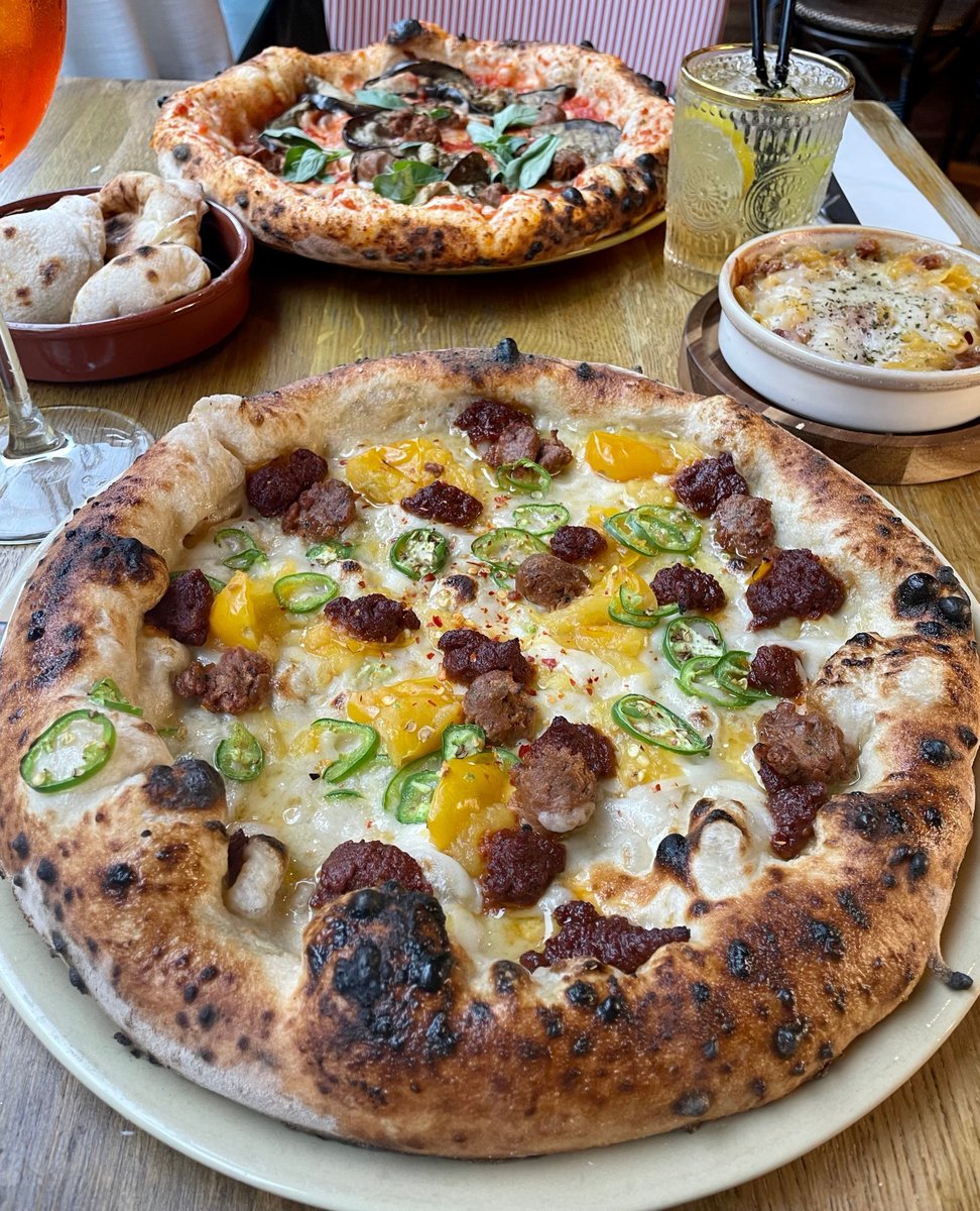 Nduja wanna slice? 🍕 A delicious white base with Mozzella, yellow tomatoes, green chillis, nduja, crumbled sausages, chilli flakes 🌶️ - The Nduja Pizza. Who's joining us this week? 🙌 #purezza #veganuk #veganfood #veganpizza #manchester #brighton #camdentown #ndujapizza