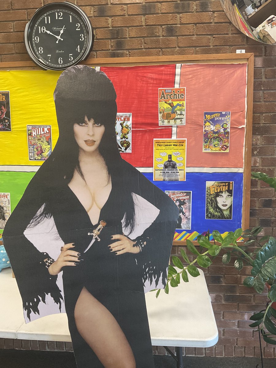 mcpl1965's tweet photo. Our honorary librarian Elvira is back!  She's here to remind you that Saturday, March 25, 2023 from 11:00 am to 5:00pm is our Mini-Con!  Hope to see you there!  #elviramistressofthedark #comicon #backfromhiatus #libraryprograms #librariesareawesome  #librariesareawesome https://t.co/Kh5PW2Smd9
