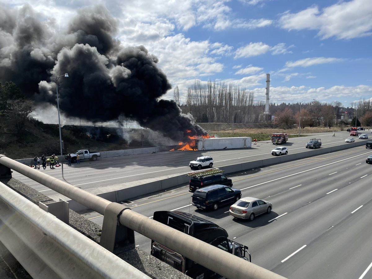 FifePD's tweet photo. For those traveling NB on I-5 near Port of Tacoma Road, there is a large back up due to a rollover semi truck collision and fire. Tacoma Fire Department, WSP and Fife PD are on scene. https://t.co/2q3E584EeH