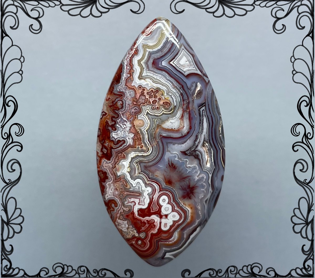 Laguna Lace Agate, 
42mm x 22mm x 6mm 7.1 grams Gorgeous red lace bubbling against white and lavender bands. Handcut by Nyssa in Arizona USA c21-743
#lagunalace #laceagate #cabochons #lapidaryarts #silicadreams