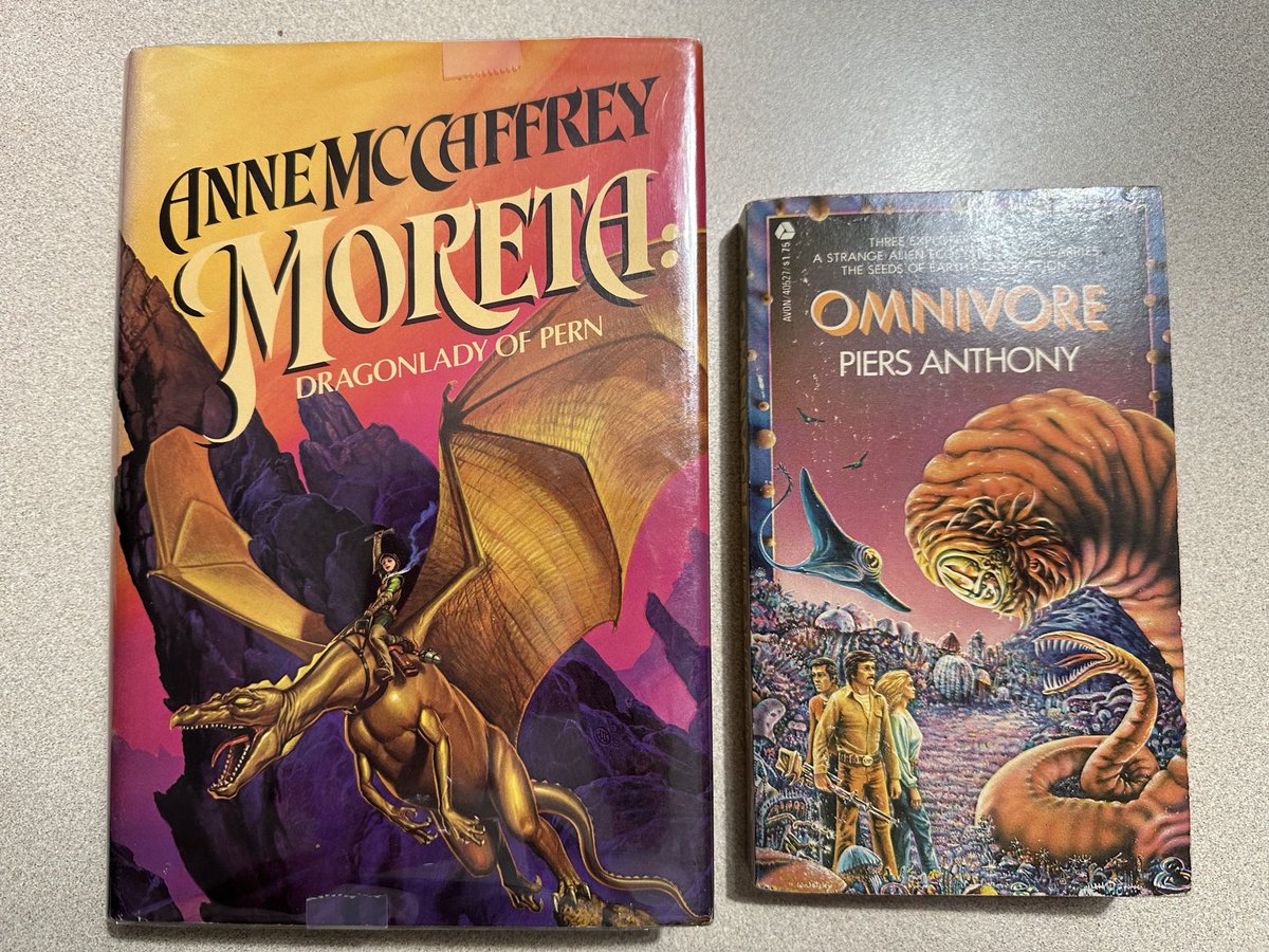 SkekTek's tweet photo. In Hawaii I got to go in an independent used book store and picked these gems up cheap. Great books from my youth! #Moreta #Dragonriders #Pern #Omnivore. https://t.co/peA8og1NI9