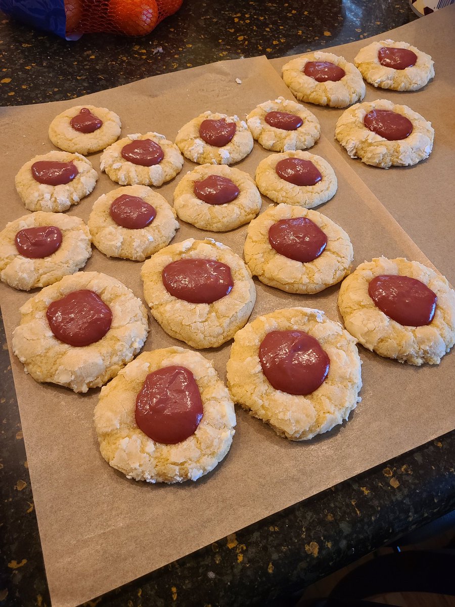 BakingWithEve's tweet photo. lemon crinkled thumbprint cookies with raspberry curd #BakingWithEve (i know the curd looks like shit, i dont have the patience for piping, so i just hurled a spoonful at each one) https://t.co/x0d4VT0hJe