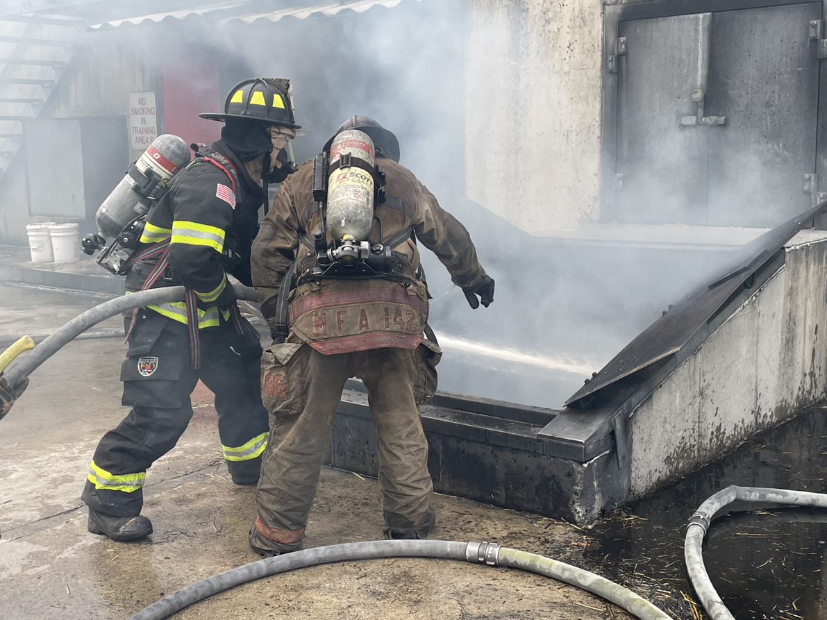 MassDFS's tweet photo. #FirefighterTraining: These firefighters are engaging in firefighting practices according to NFPA 1700, Guide to Structural Firefighting.  They used tactics to cool the environment prior to entry, utilizing a transitional fire attack before advancing the hoseline interior. https://t.co/Op90MJ8dV1