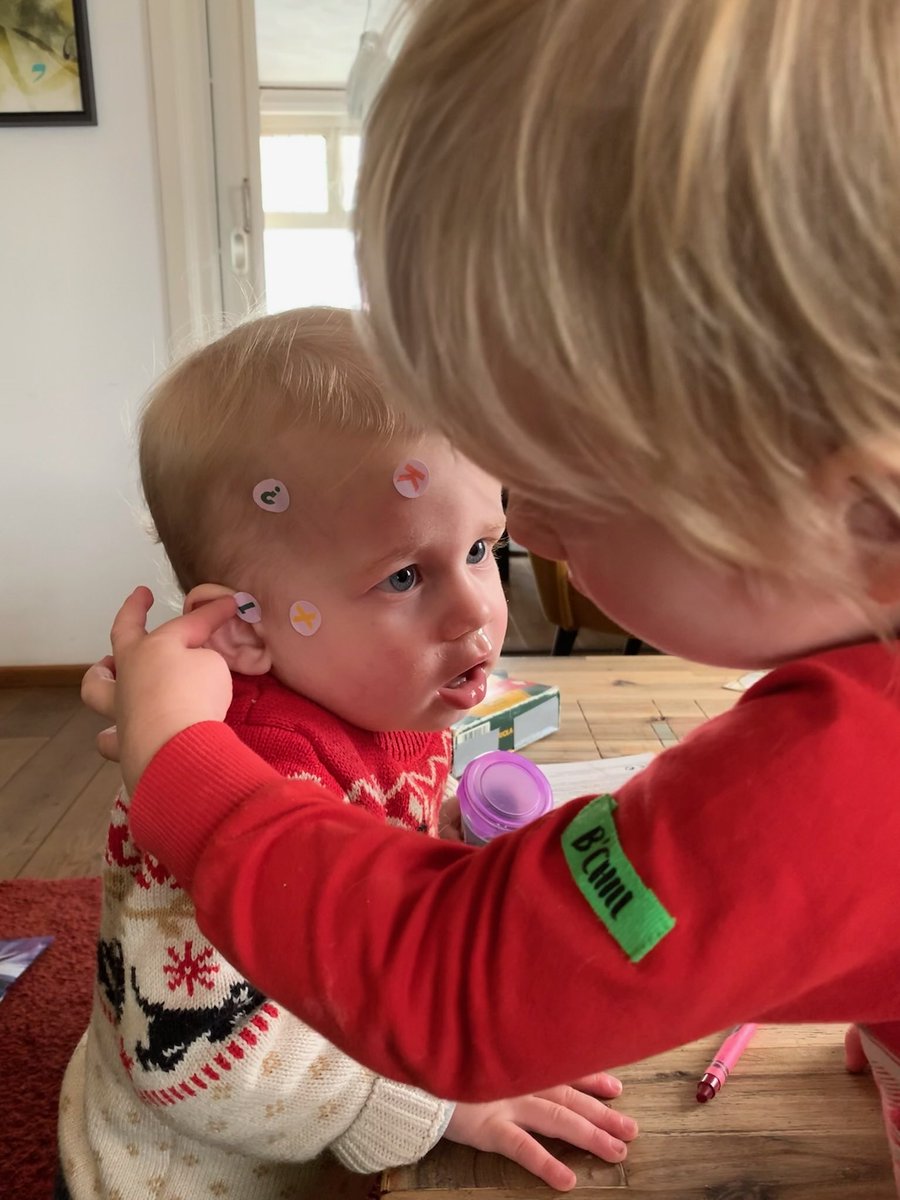 My middle child practising EEG placements on his younger brother #teachthemyoung #academiclife