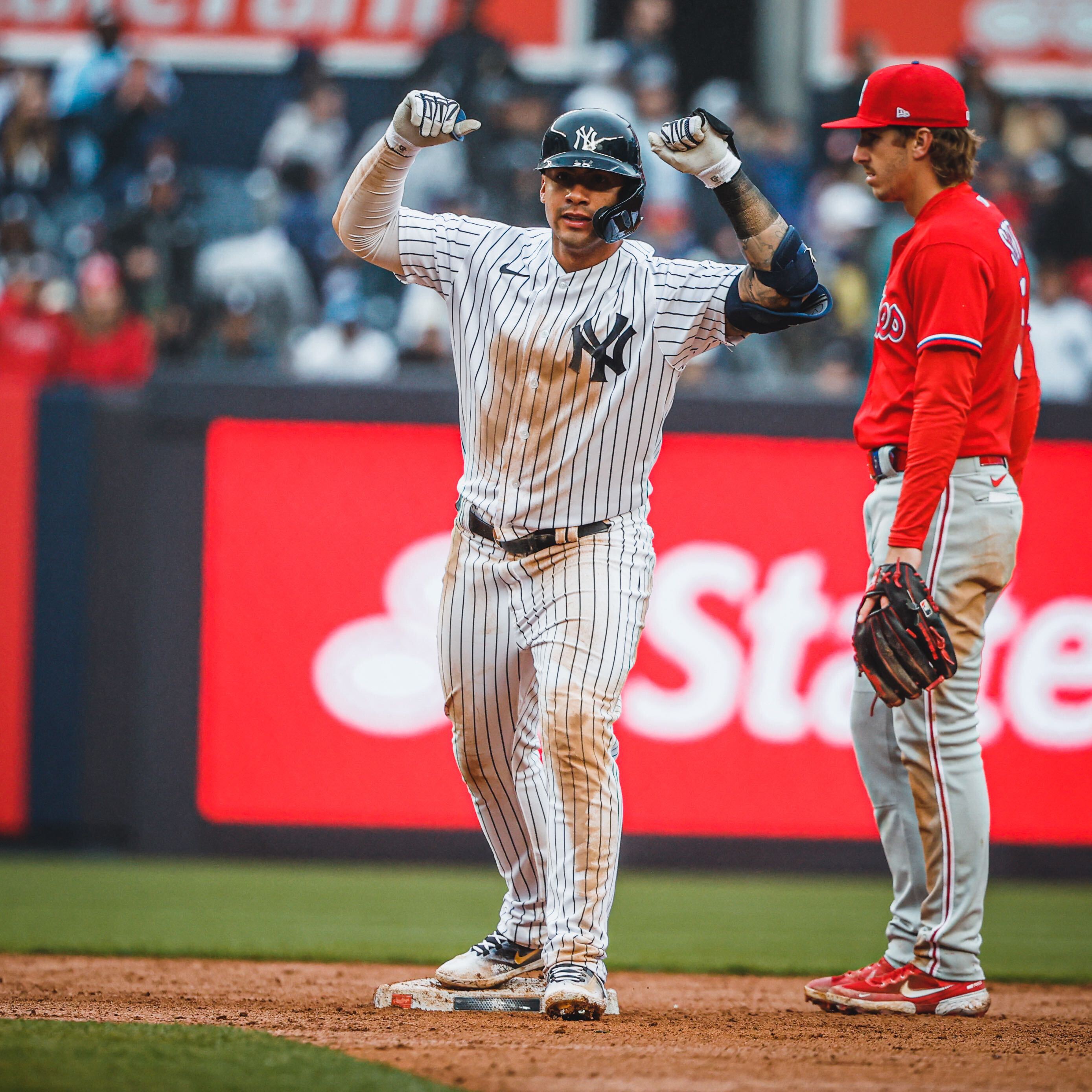 Gleyber Torres puts up both his hands after hitting a double. 