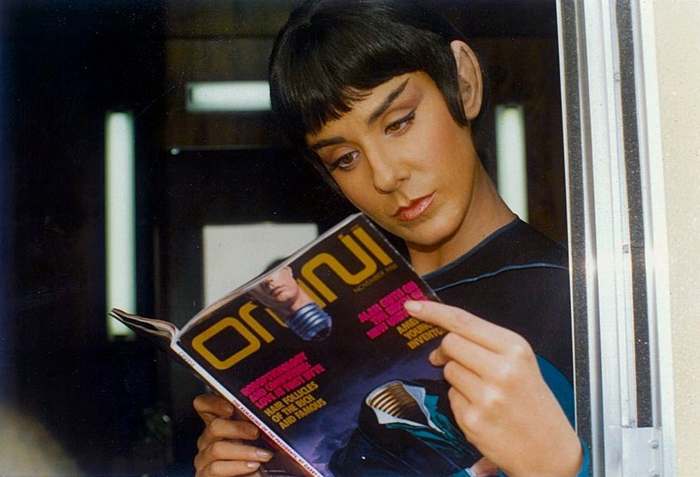 suzie plakson reading the november 1988 issue of omni magazine on the set of "star trek: the next generation"