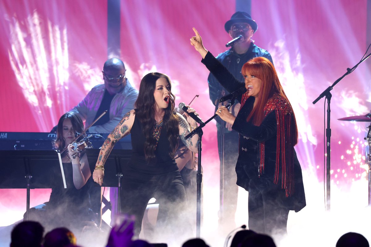 Wynonna's tweet photo. Another unforgettable night @ the @CMT awards! Getting to sing w/@ashleymcbryde over these past 6 months has been one of the highlights of my career, &amp; to close it out with a song I love so much was such a moment for me. I am confident in this woman’s ability to carry the torch❤️‍🔥 https://t.co/gxaVSAXXKs
