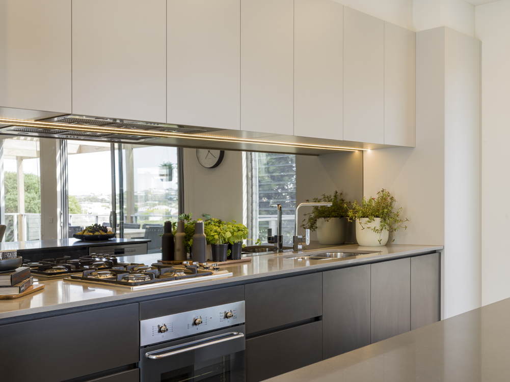 BespokeHQ's tweet photo. The kitchen of Bespoke Derbyshire House 4. The contrasting cabinetry with mirrored splash-back are stunning feature of this open plan kitchen. The galley style kitchen has a great layout that would suite any cook. 
Photo@dean_walters Supplier| @derbyshirehomes @grovedale_kitchens https://t.co/BUsiJ7u2FU