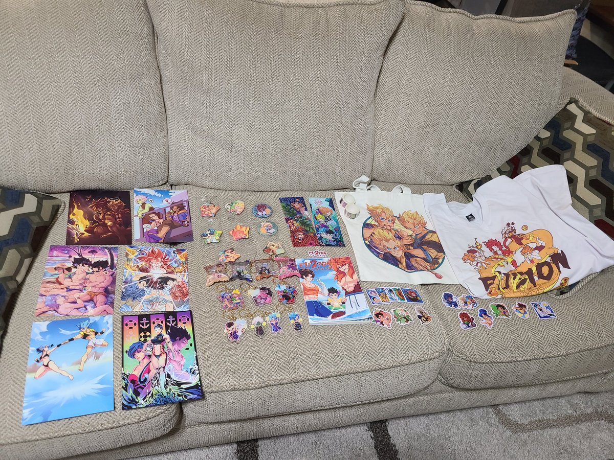 BiscuitSanji's tweet photo. I had to spread it out on my sofa!  The @DBFusionZine and alllll the merch arrived! Look how gorgeous and colorful! I can't even describe jow wonderful the quality is!! And the art is sooooo good 💚💚💚💚

Thank you again to the admin team for allowing me to contribute! https://t.co/9fNfvXWce6