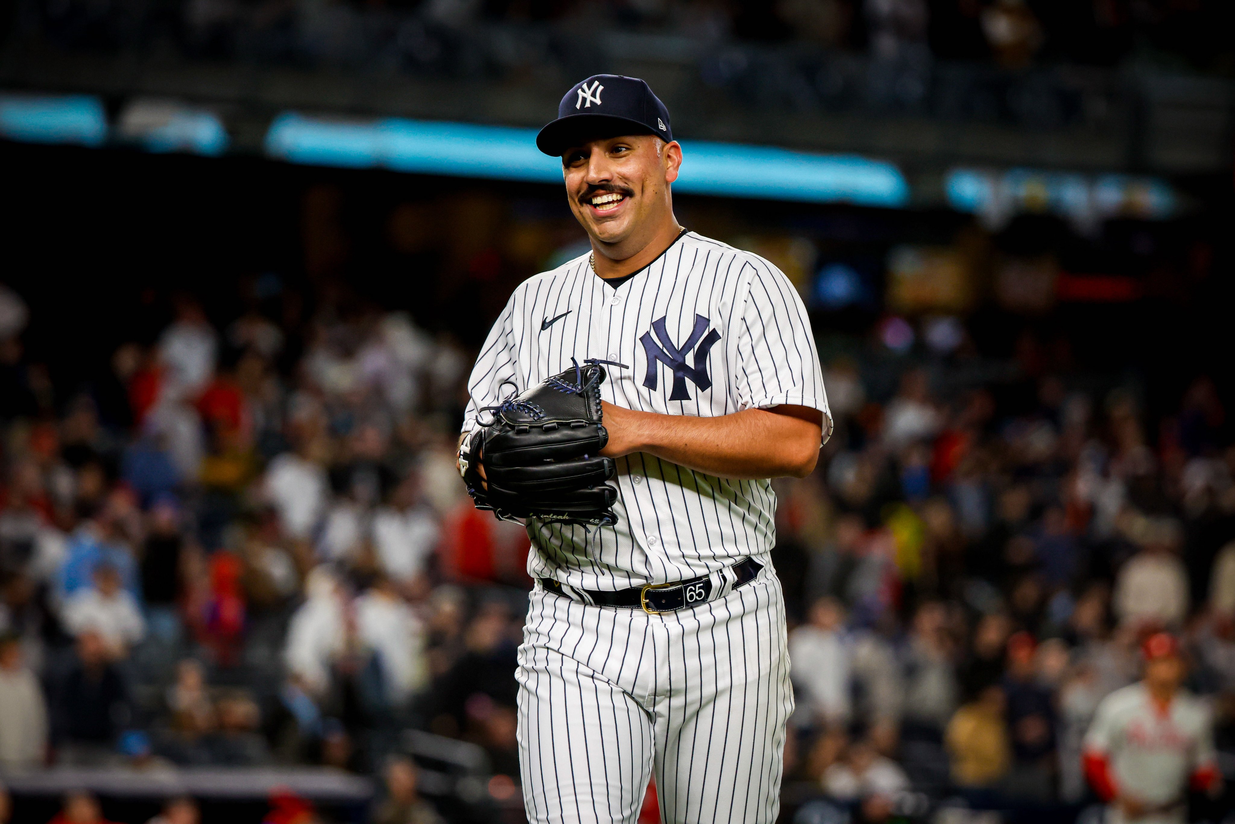 Nestor Cortes smiles after pitching. 