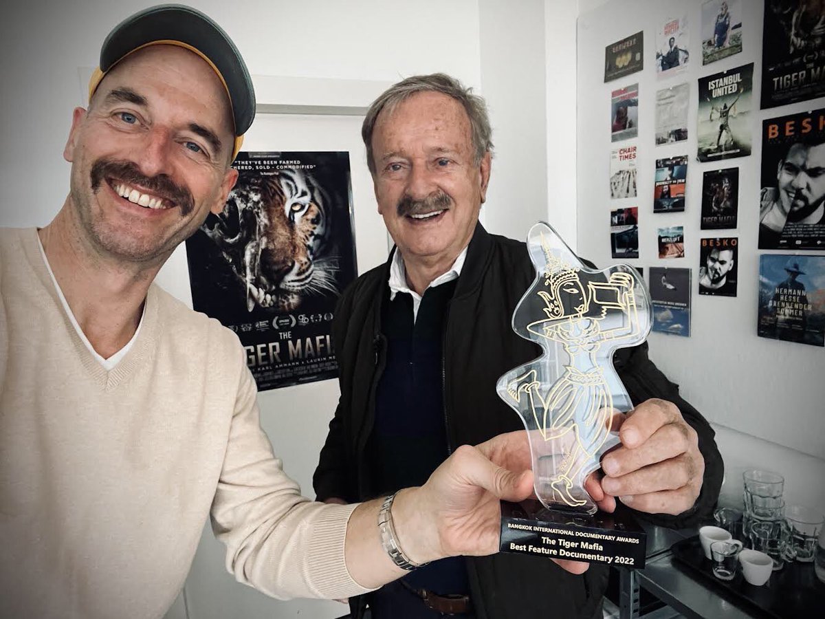 We are so glad to share this picture from Switzerland. Congratulations to Karl Ammann &amp; Laurin Merz, director and producer of “The Tiger Mafia” for wining an award at BKK DOC 2022. 
Watch the trailer: youtube.com/watch?v=kzKTu-…
#bkkdoc #documentaryfilm #bkkdoc2022 #openforsubmission
