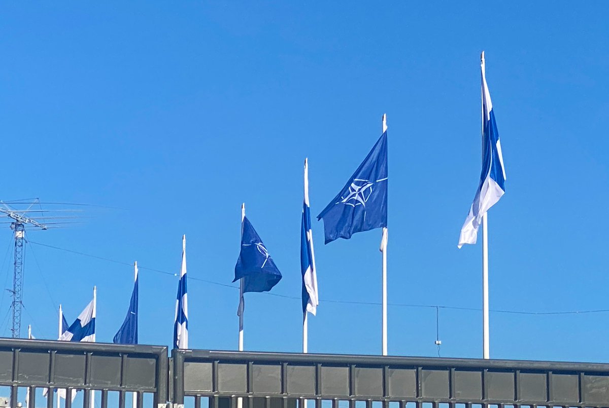 Nato flags now flying at the Finnish Foreign Ministry in Helsinki. Some people arrived to watch and pop champagne. #nato #finland