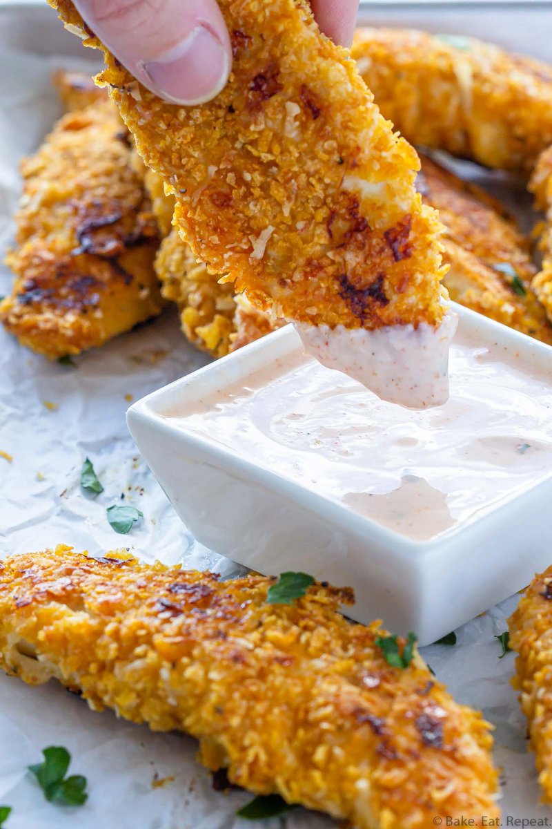 These baked chicken tenders are coated in corn flake crumbs (or panko) and bake in the oven. They're super crispy and so easy to make! Get the recipe: bake-eat-repeat.com/baked-chicken-…