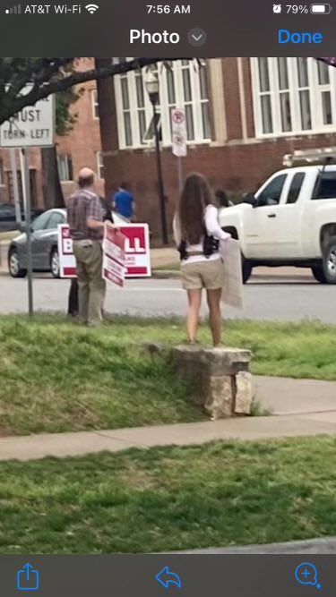 _natemorris's tweet photo. It’s election day in a Tulsa. 

This morning, people armed with guns holding signs supporting Jared Bushwell for School Board stood outside of a TPS elementary school while parents were dropping their children off. https://t.co/9jES4Arfh0
