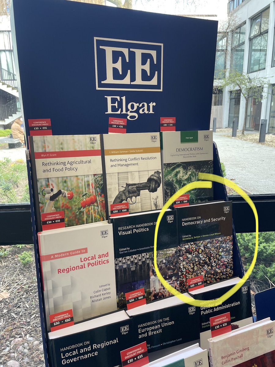 KeelyEshenbaugh's tweet photo. Spotted the new Security and Democracy Handbook (@slloydwilson editor) at @PolStudiesAssoc in Liverpool! It was neat to see it in print and on the stand as a contributing author https://t.co/UDzHoNGkny
