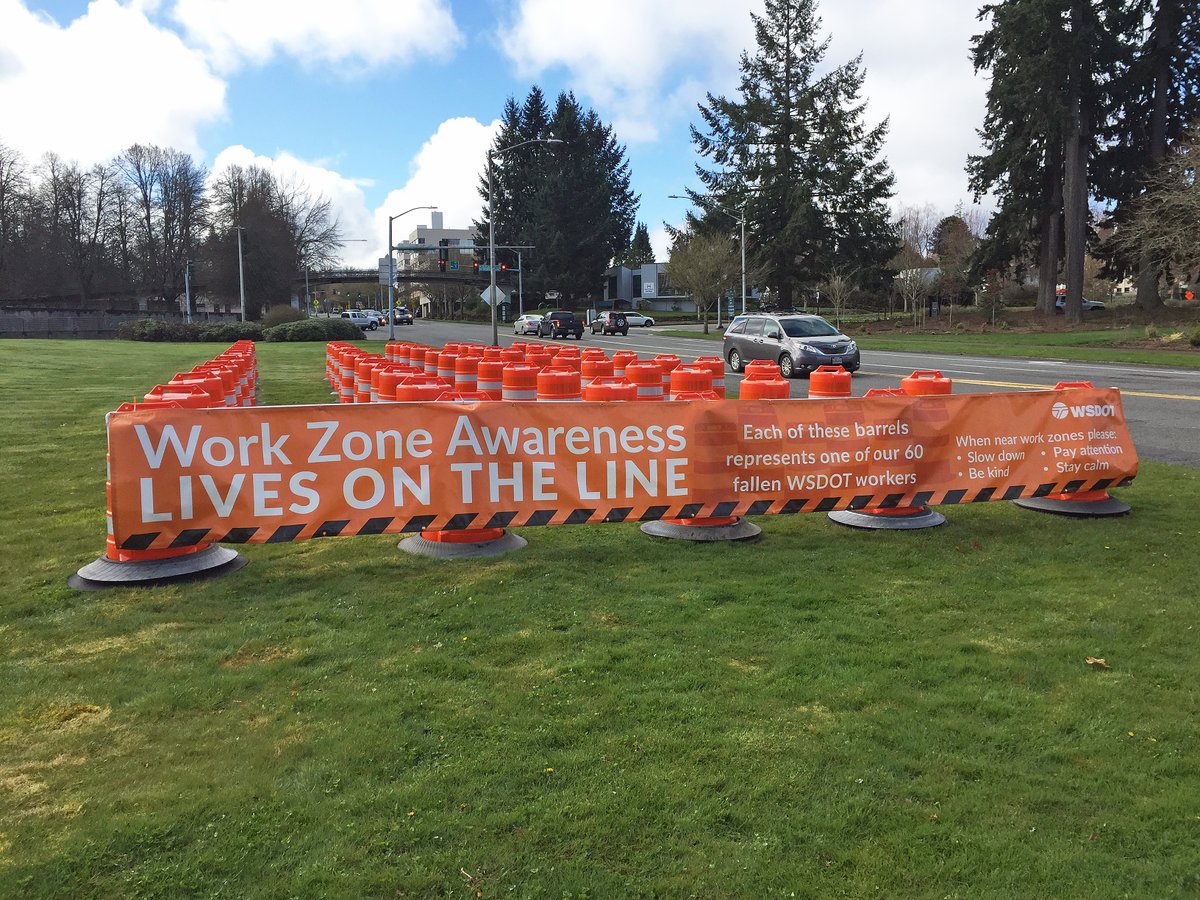 wsdot's tweet photo. A display of 60 barrels representing each of our colleagues who have died in a work zone since 1950 near Capitol Way in Olympia. We will be remembering and honoring those workers at our Worker Memorial event today. https://t.co/A9L0L9xBag