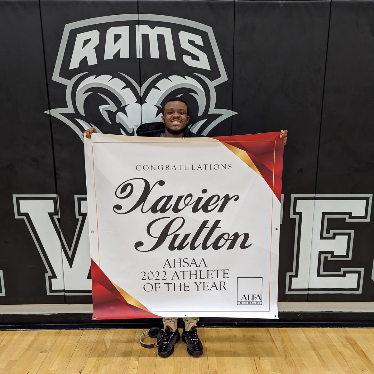 Xavier Sutton of <a href="/BrewTechMagnet/">BrewTech Magnet</a> holds the banner declaring him the Alfa Insurance/AHSAA 2022-2023 Student Athlete of the Year. He was announced as the Athlete of the Year during the World Games last year. #MPSRising