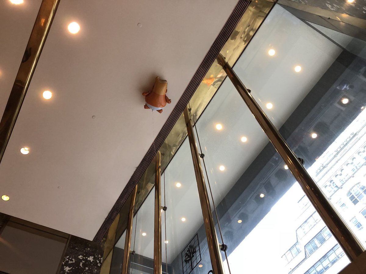 TrueFactsStated's tweet photo. That time we visited Trump Tower with Trump balloons and I accidentally let one go.. https://t.co/OUjYfwNywa