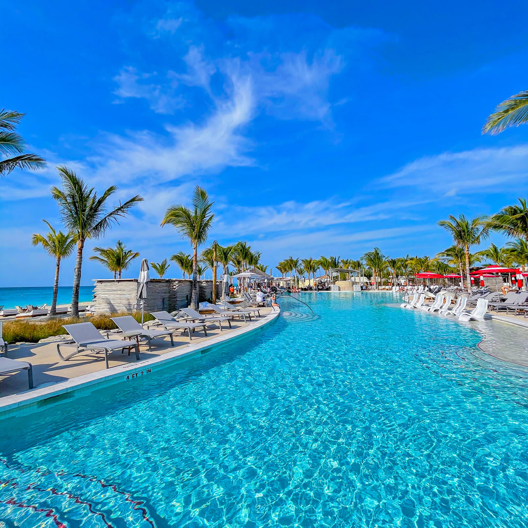 CruiseWonder's tweet photo. Cruise to Bimini Beach Club – a haven for fun and relaxation where Virgin Voyages passengers can relish their time on the island. Relax on the sand with a cocktail, or dance the night away at an exclusive pool party! https://t.co/YsR6mQo9JT https://t.co/hpUpo0QnbR