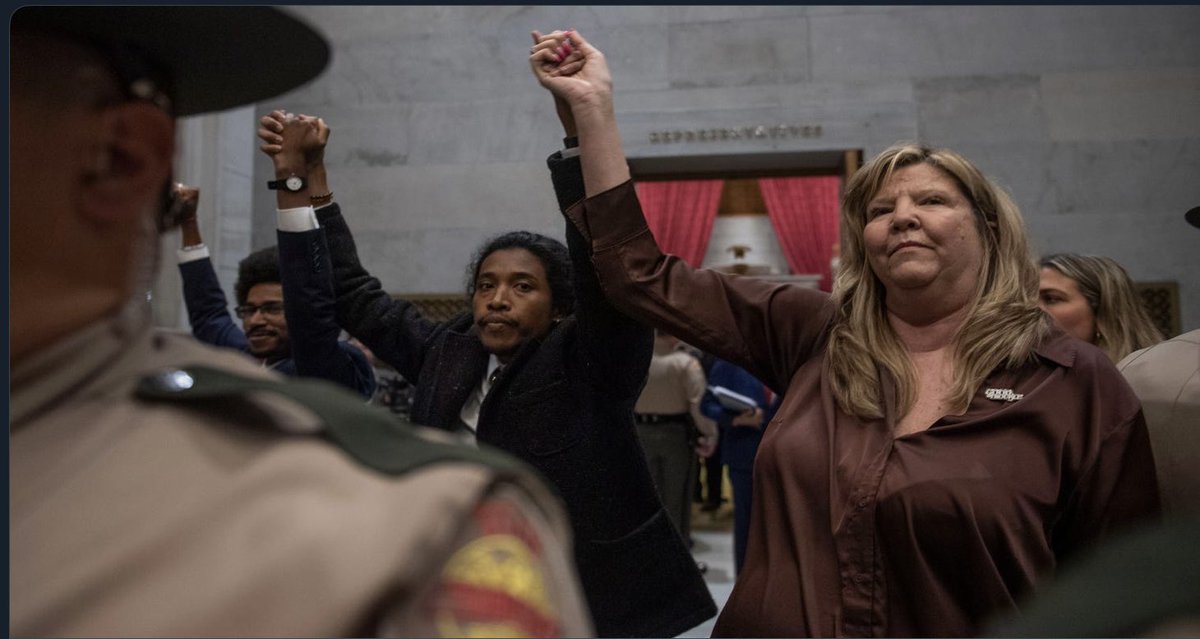 BrianHearon's tweet photo. Such a shame that #TennesseeThree is trending. Politicians who can’t have their way scream fascism! Notice they stand behind an armed trooper for protection, yet they don’t want our children protected this way! Fascism is run through dictators, you were elected by the people! https://t.co/ZAEAsCCi1J