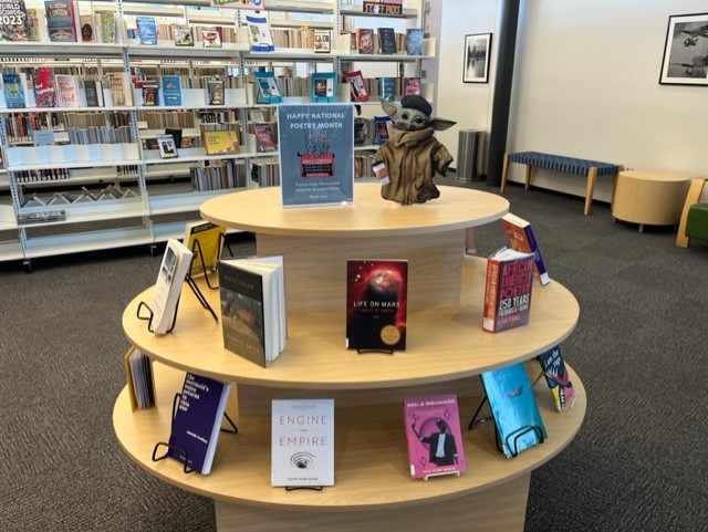 PhxLibrary's tweet photo. Did you know April was #NationalPoetryMonth? Baby Yoda does! Come to #CesarChavezLibrary to visit this curated poetry collection & read a poem. Happy poetry reading! https://t.co/rjYT5ZfFjw #JustReadPPL #PhoenixPublicLibrary #PHX https://t.co/4vP5wZcdtG