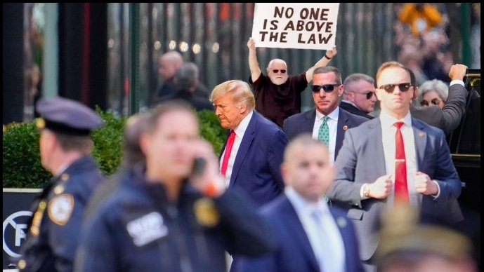 ShitzN_Giggles's tweet photo. I didn't see #TheSignGuy at Trump's #PerpWalk, so I decided to make my own memory of the moment, and would like to share that with you. https://t.co/BKRuKcbCmE