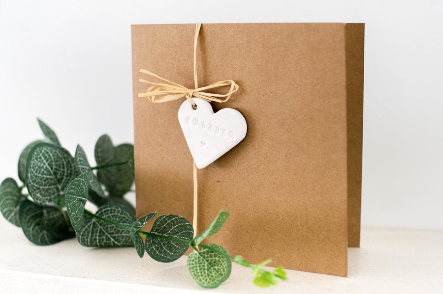 Engagement Card with handmade Clay hand stamped charm // Card for Couple // Congratulations // Announcement tuppu.net/6cdd34a3 #HoneywellWeddings #Wedding #Etsy #weddingsignage #Bridetobe #rusticwedding #CelebrationEngaged
