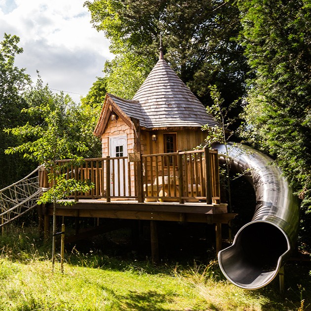 BlueForest_'s tweet photo. Ready to take your treehouse to the next level? Add a slide! 🛷🌲 Not only does it make getting down from the treehouse more fun, but it also adds an element of adventure to a lofty hideout in the trees. #TreehouseFun #SlideIntoAdventure #ChildhoodMemories https://t.co/1xeao7DIlD