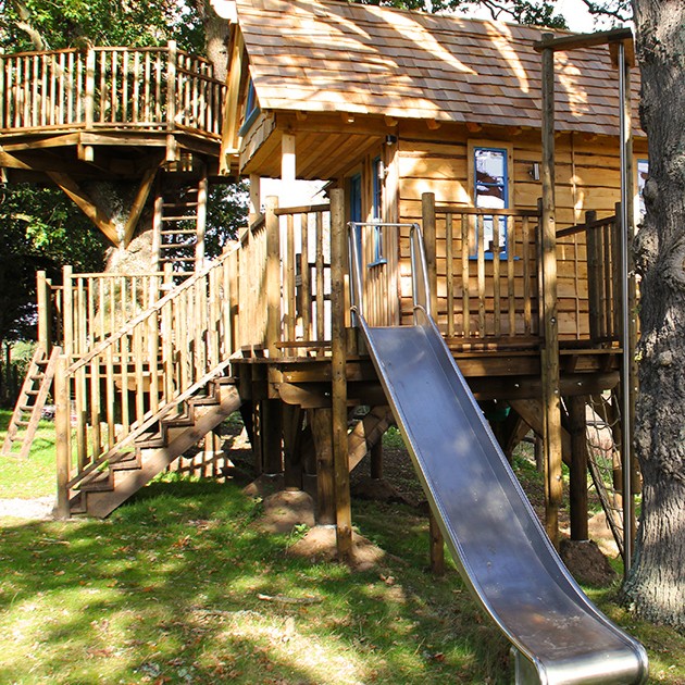 BlueForest_'s tweet photo. Ready to take your treehouse to the next level? Add a slide! 🛷🌲 Not only does it make getting down from the treehouse more fun, but it also adds an element of adventure to a lofty hideout in the trees. #TreehouseFun #SlideIntoAdventure #ChildhoodMemories https://t.co/1xeao7DIlD