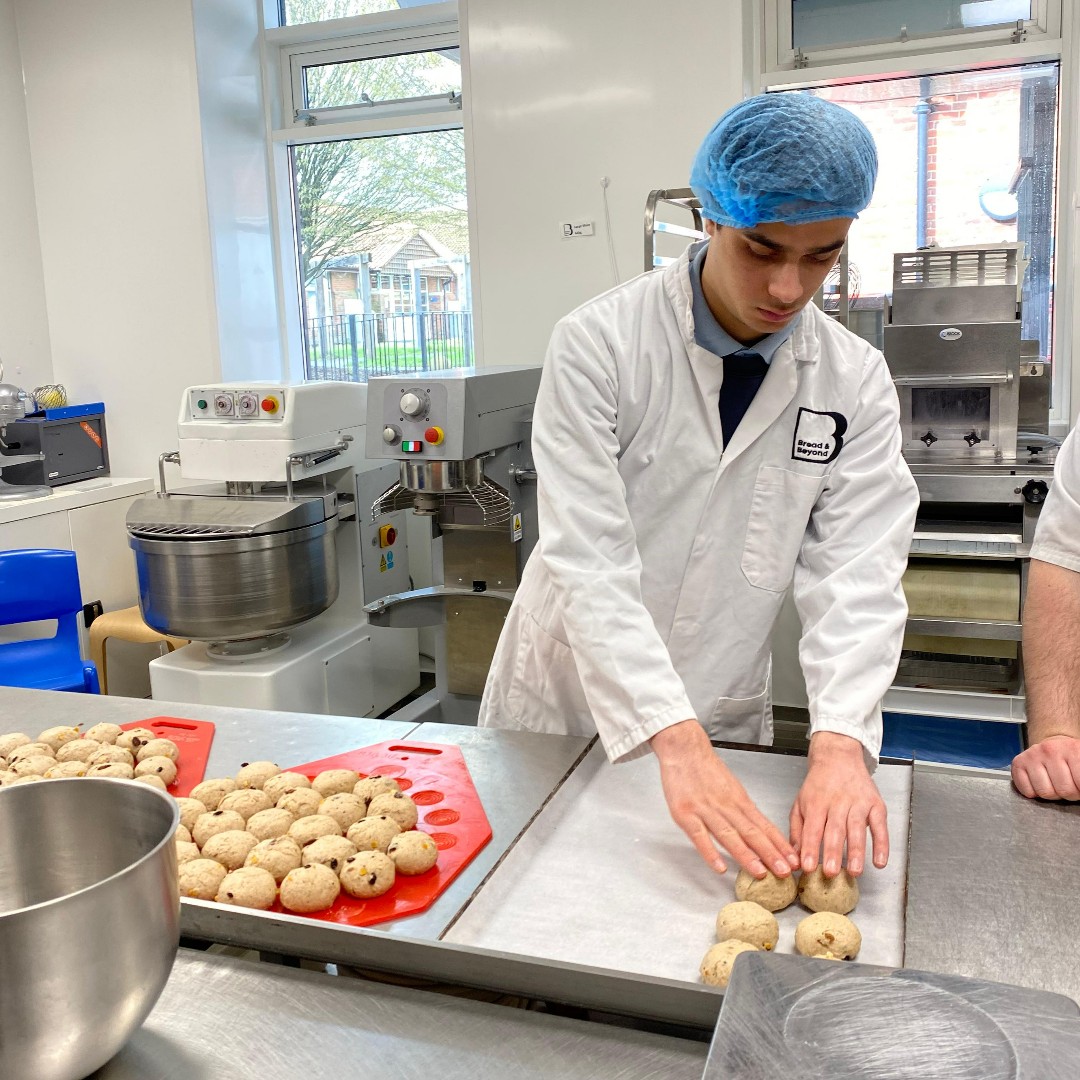 breadbeyondUK's tweet photo. Easter is coming up, and that can only mean one thing. Trainee Baker Daniel has been hard at work prepping bus-loads of hot cross buns! We've tried them and can confidently say they're his best work yet. Well done Daniel! #autism #baking https://t.co/GaiWezQr2e