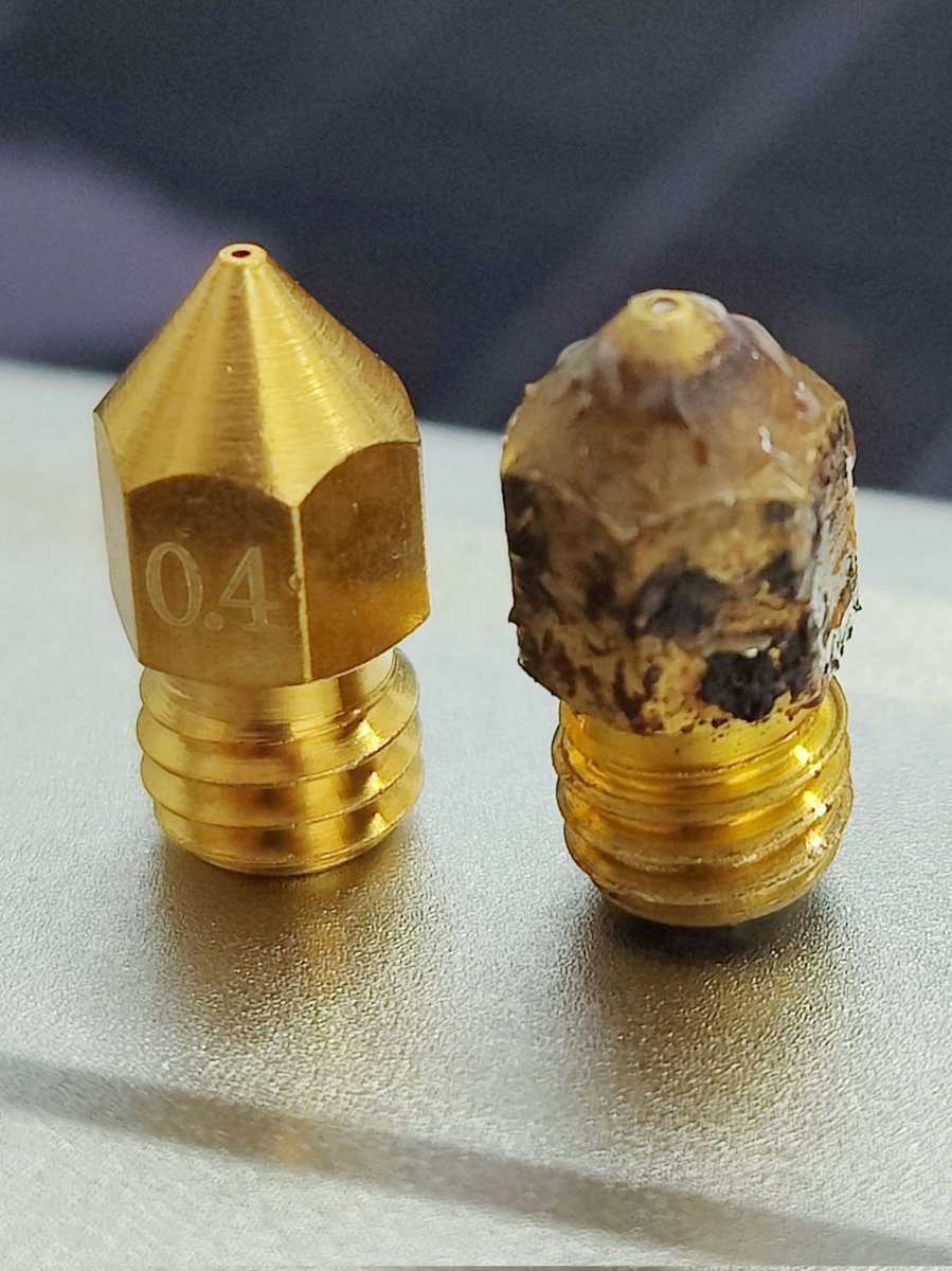 WolfyMode's tweet photo. #3Dprinting 
After almost two years of printing (PLA&amp;PETG only) I finally changed the nozzle on my printer.I was always avoiding to do that just because i didn't want to damage hot end but advice to all #3Dprintingbeginners -dont get trapped with old nozzle and degrading quality https://t.co/digjfEsydn