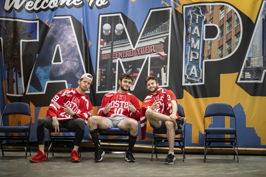 Drew Commesso Nick Zabaneh and Domenick Fensore sit in front of a Welcome to Tampa sign
