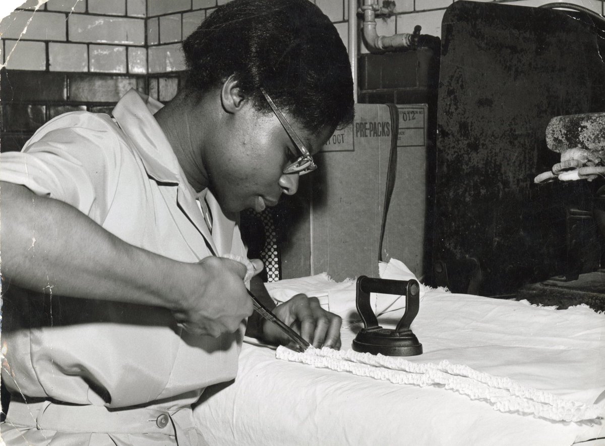 Nursing caps are seen as source of pride for nurses and most hospitals have unique designs, styles and methods of folding these caps. Here is a picture of a laundry worker goffering a London Hospital sister's lace cap with iron and tongs c.1960s

#ArchiveFashion #HistNursing