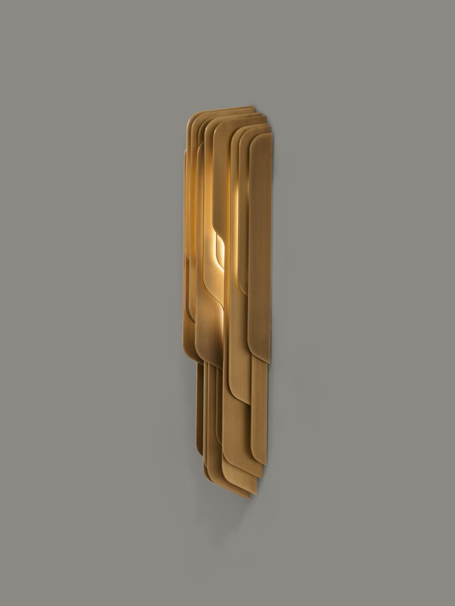 purcell_design's tweet photo. Illuminate your space with the sculptural Wesley sconce. Shifting fins interact with the diffuser light source, creating a mesmerizing play of highlights and shadows. With shafts of light thrown up and down the walls, this sconce is sure to captivate your attention. https://t.co/WdRsYsKOoT