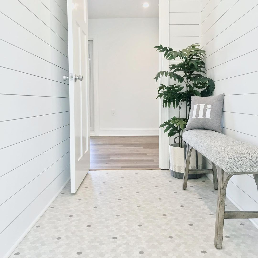 We’re loving how our Penny Lane luxury vinyl sheet flooring adds the perfect touch of modern nostalgia to this charming mudroom! Image via @uglyducklinghomes IG. Color shown: Quartzite with Granite. Learn more: bit.ly/3ZgMzxt