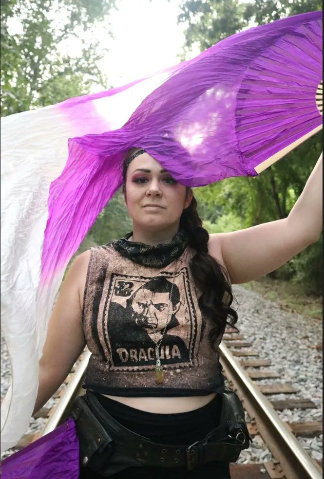 HellKittenRVA's tweet photo. Flashback FRIIIIIIyAY! Check out @divinepossum rocking one of her HANDPRINTED Dracula crop tops! Each top, Bag, and Patch from our double fans goddess is handprinted from a one of a kind hand carved print! Should we bring the Dracula crop top back? Please comment below! https://t.co/rEYVfoJEjT