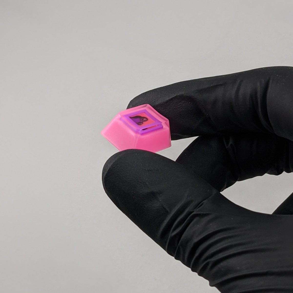 absentience's tweet image. My custom framing job for @cyberbanditsNFT #2287 is complete!

I went with a 0.39 inch purple polyurethane frame encapsulated inside an epoxy keycap. I think the coral really pops on my pink wall, what do you think? ...wait, what?

#NFTkeycap #microframe #FanArtFriday