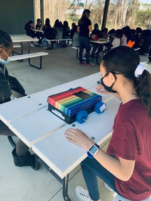 ZebulonMagnetES's tweet photo. Mrs. Bridgers 5th grade class enjoying the beautiful weather today working on Force and Motion Graphs units in science. Students created a mobile unit and next week they will finish up lesson by creating distance time graph!! @ZES_Principal @wcpssmagnets https://t.co/wP2rQ2mz07