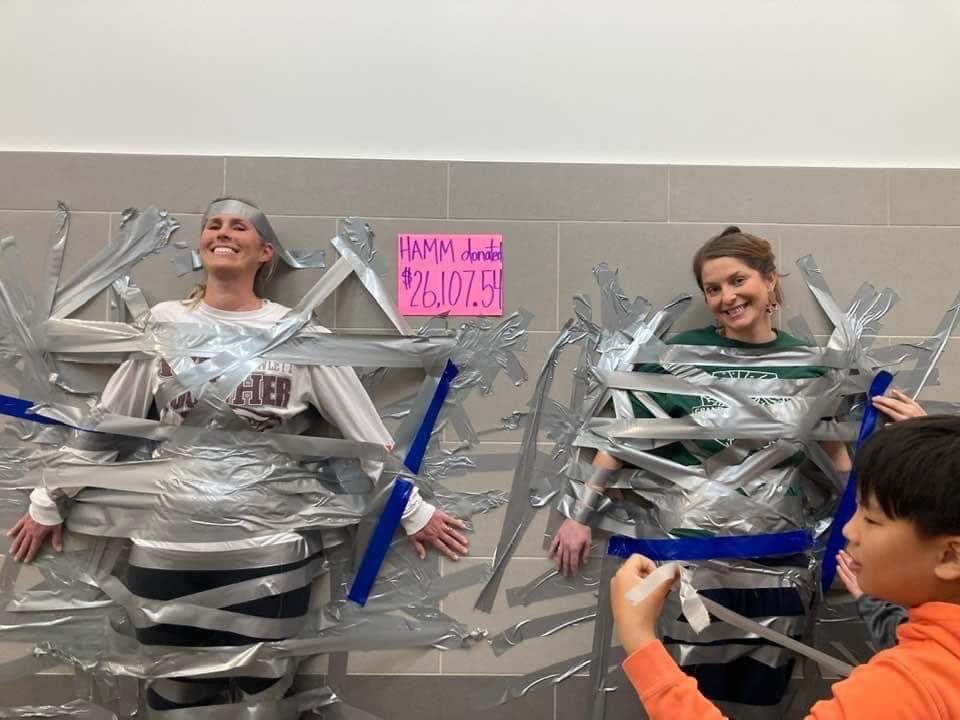 .<a href="/hammelem/">Sherry & Paul Hamm Elementary</a> has been learning about heart health through <a href="/American_Heart/">American Heart Association</a> Kids Heart Challenge. Hamm Heroes were challenged to raise $15,000 and surpassed that goal - they raised $26,107.54! The highest donors got to duct tape Coach Marshall and Principal Patterson to the wall!