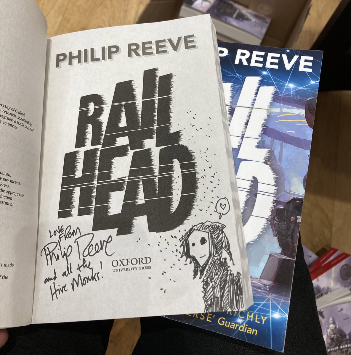 philipreeve1's tweet photo. I also signed a bunch of ‘Mortal Engines’ books while I was in @waterstones_exe, and a couple of copies of interplanetary-train-heist-thriller #Railhead (complete with friendly Hive Monks). https://t.co/yxcUu65UJz