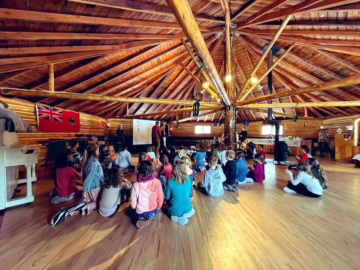 ASpelrem1's tweet photo. @bandedpeakrvs Grade 3/4 students were invited to celebrate some truly unique Bragg Creek history today. We visited the Round Hall, learned about local history, and danced a line dance and some polka! Happy 100th bday to the Bragg Creek Round Hall! @BraggCreekHS #rvsed #abed https://t.co/BzmIryU4jw