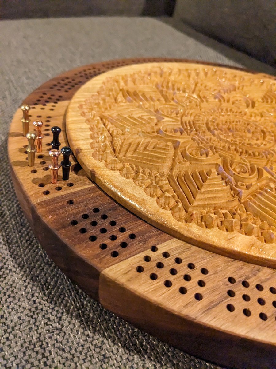 jmauser's tweet photo. Walnut and cherry round three track cribbage board with mandala carved lid and internal storage. https://t.co/vO9iQGgaXT