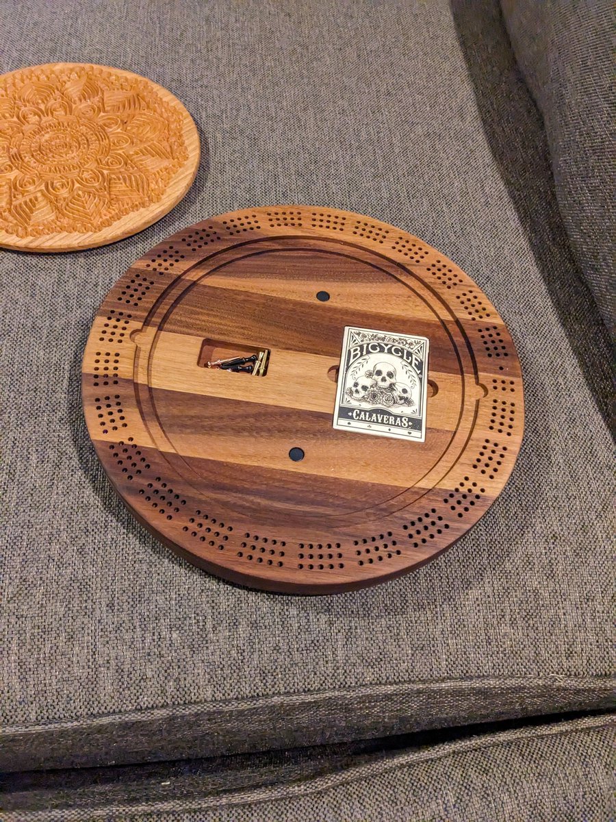 jmauser's tweet photo. Walnut and cherry round three track cribbage board with mandala carved lid and internal storage. https://t.co/vO9iQGgaXT