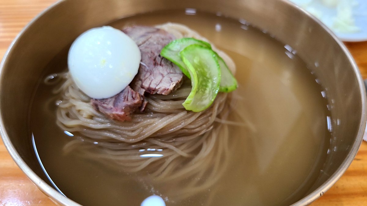 Who says you can only enjoy naengmyeon in summer? This Korean dish, with its refreshing flavors and textures, is perfect all year round. Whether you're in the mood for an icy-cold dish or a tangy treat, naengmyeon is always a great choice. 🍜❄️👌 #Naengmyeon #KoreanFood
