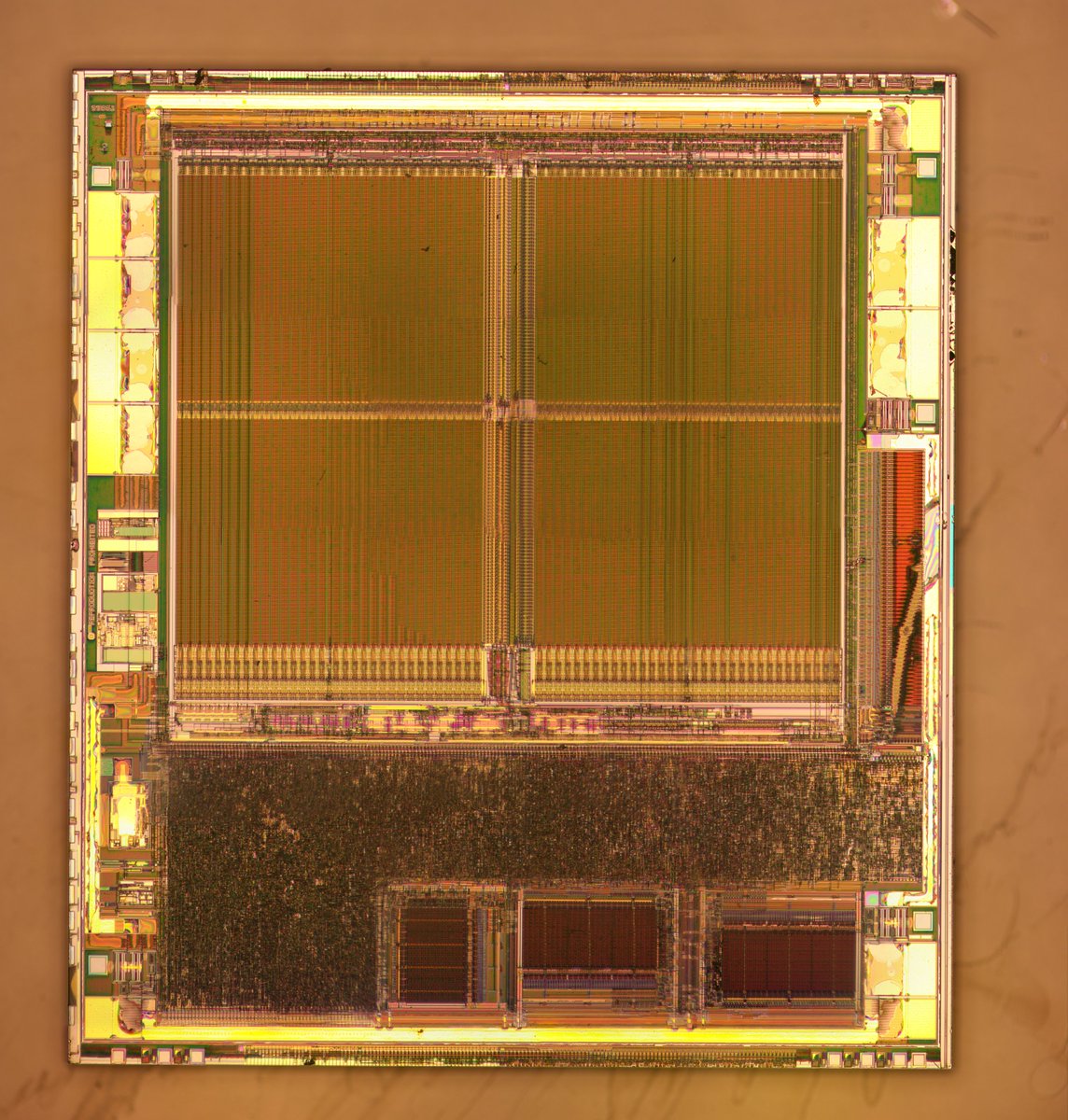 AT90SC3232C.  My photos of the surface layer failed to stitch on account of the repeated memory regions, so I only have photos after delayering.